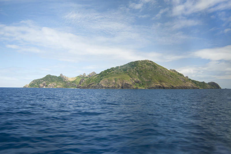 Ocean view from a cruise ship of Kuata Island , Fiji, which his uninhabited but has a small eco resort for tourists