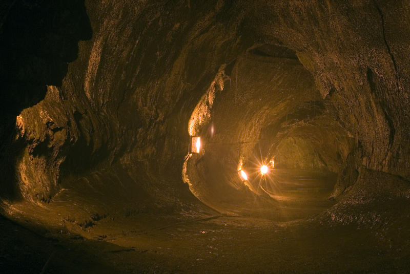interior of a subterranian tunnel formed by and once filled with lava since erroded by water to form an empty tube