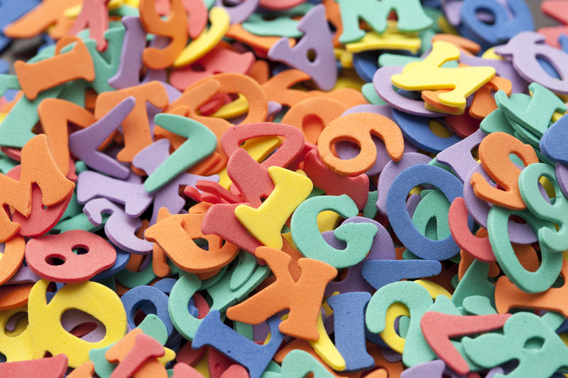 Colourful jumble of colourful letters and numbers for teaching preschoolers and kindergarten children their alphabet and mathematics