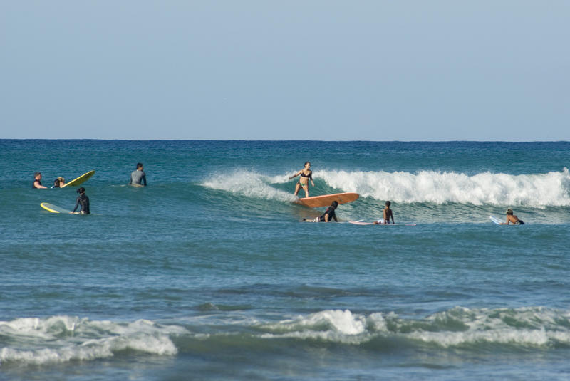 surfers off the oahu coast, waikiki beach, hawaii
