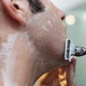 6937   Male grooming concept of man shaving