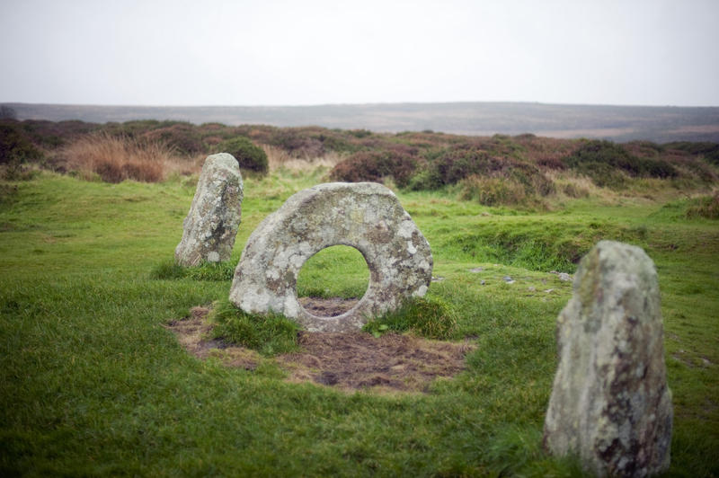 Men-an-tol, Cornwall, a prehistoric standing stone formation with a rare holed circular granite stone flanked by two uprights, now a protected monument