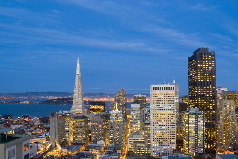 last moments of daylight illuminate a spectacular view of san francisco downtown office buildings