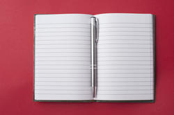 5363   Opened notebook with a pen in the centre