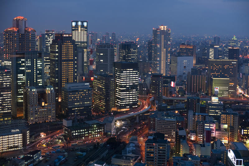 brightly lit buildings of Osaka at night, Japan