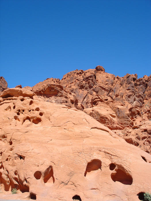 red desert rocks contrasting against a clear blue sky