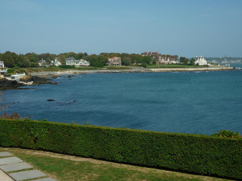 Rhode Island coastline with a view across a bay towards a row of the large waterfront mansions typical of this neighbourhood