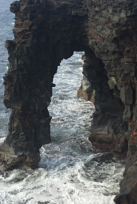 Natural volcanic rock arch at Holei on the coast of Hawaiis Big Island
