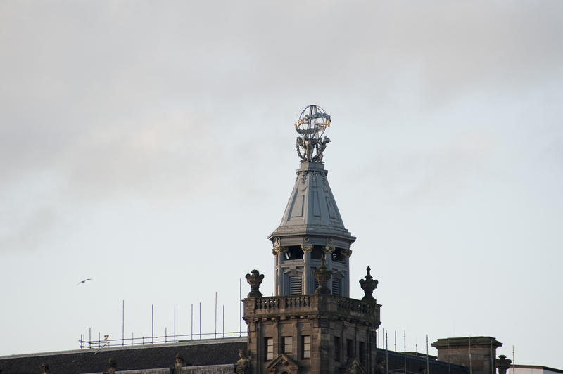 Rooftop cherubs, princes street edinburgh, a decorative rooftop architectural finial with signs of the zodiac