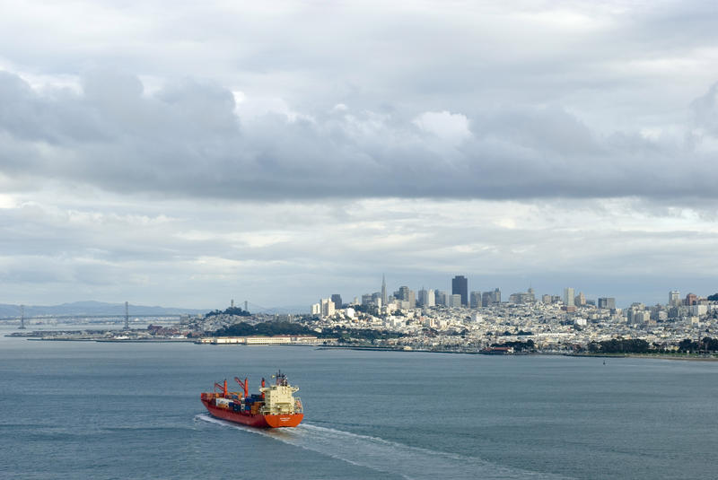 Loaded cargo ship bringing imported products into the bay of san francisco