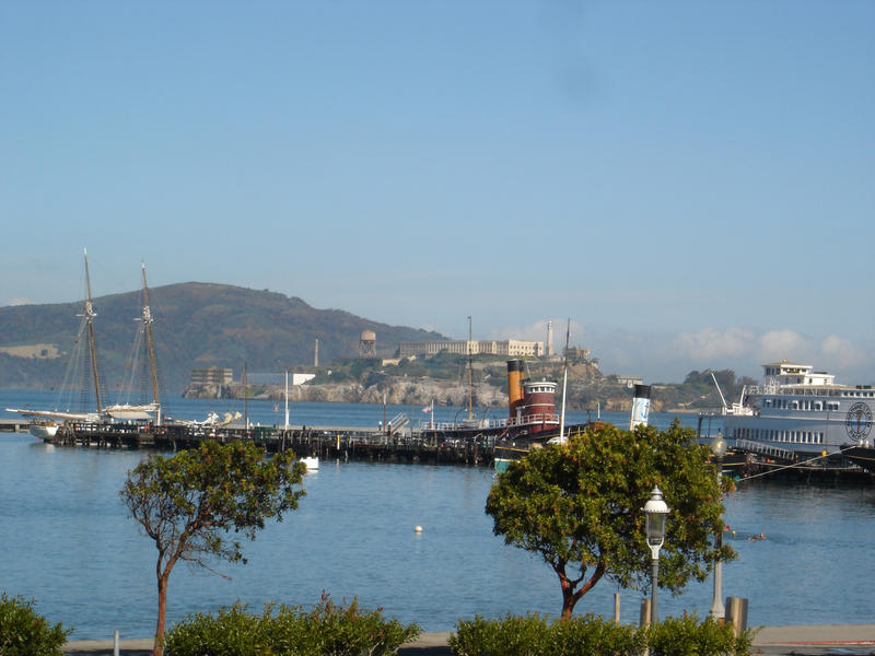 historic wooden pier and the island of alcatraz, san francisco