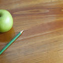 7024   School desk with pencil and apple