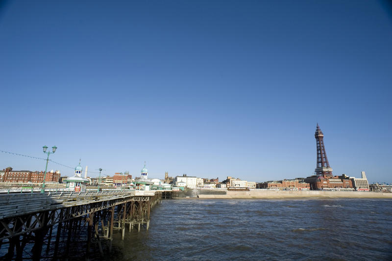 View from the Blackpool North Pier of the shoreline and waterfront with the historic Blackpool Tower