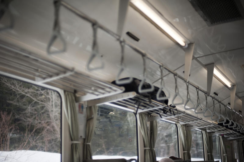 narrow depth of field image of the interior of an empty passenger train