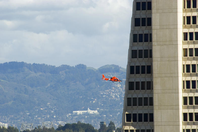 helicopter flying behind one of san franciscos most recognised buildings - not property released