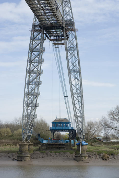 Lattice steel structure of the historic Transporter Bridge crossing the River Usk in Newport, Wales