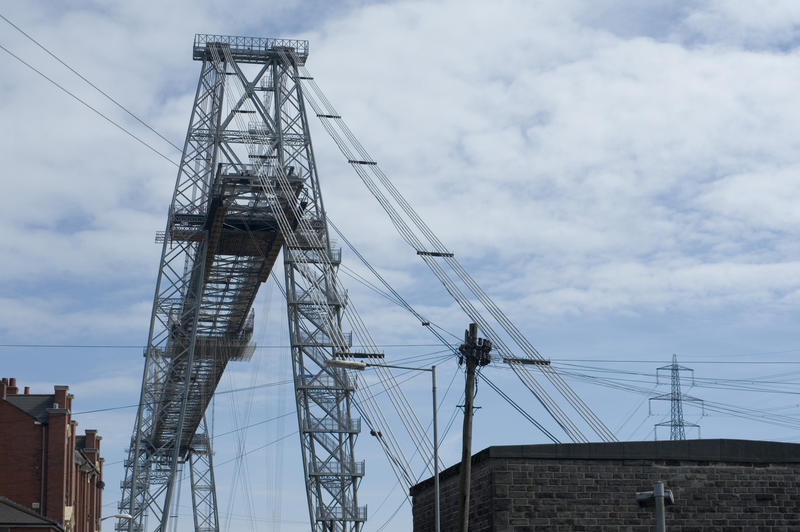 Historic Transporter Bridge crossing the River Usk in Newport, Wales, one of only eight remaining in the world with a suspended gondola or platform used to transport cars and people across the span