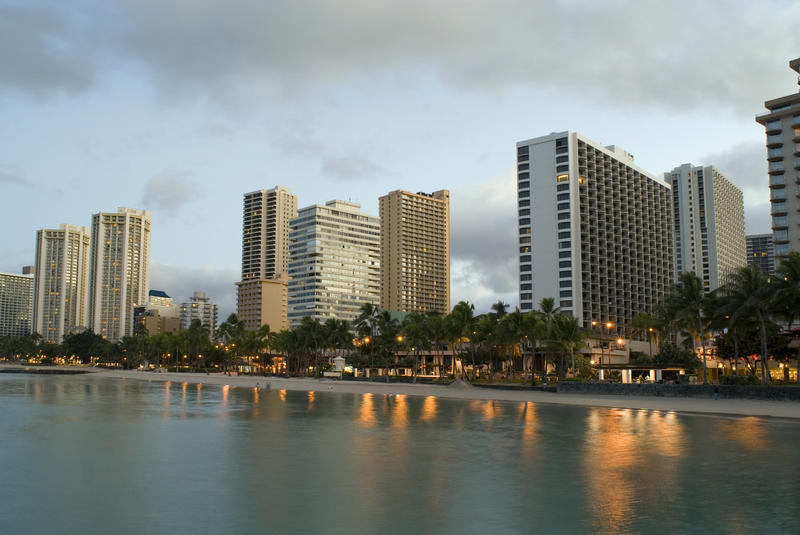 Sunrise over the many hotels on the beachfront at waikiki beach, honolulu, hawaii.