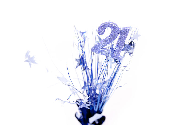 Still Life of Blue Centrepiece for Young Man 21st Birthday Celebration on White Background