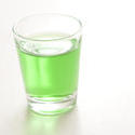 10426   Shot glass filled with absinthe