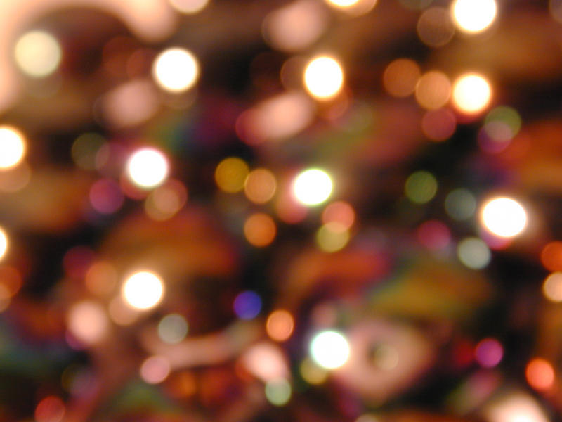 Colorful festive background bokeh of defocused twinkling party lights in a full frame view