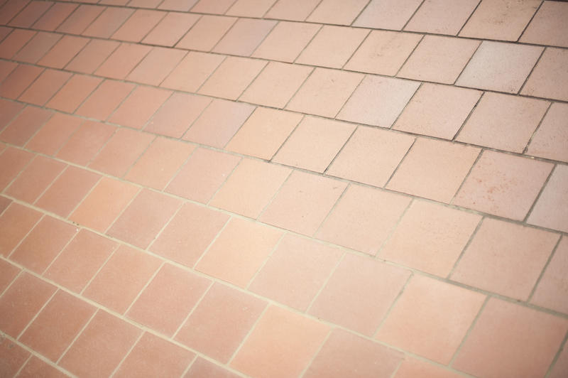 Close Up of Smooth Red Brown Brick Tiles on Floor or Wall, Architectural Detail Ideal for Backgrounds