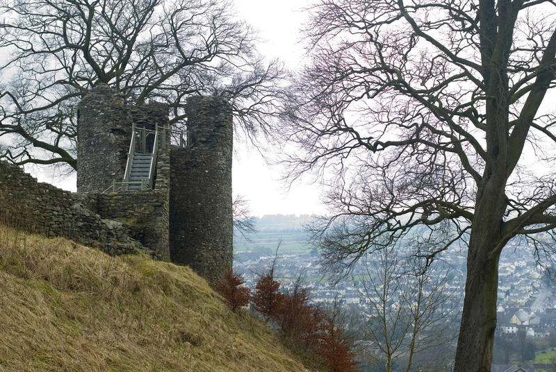 Ruins of the medieval castle tower at Kendal , a market town in Cumbria, outlined on the brow of a hill