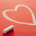 11534   White Chalk Beside Heart Drawn on Red Background