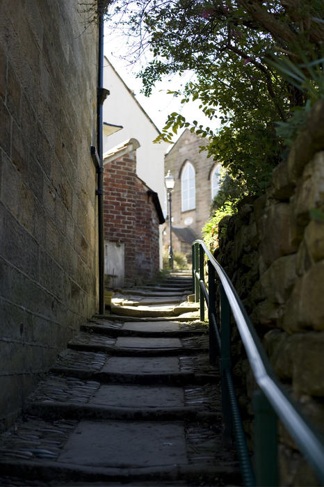 Empty flight of steps leading up the hillside to the congregational church in Robin Hoods Bay fishing village, Yorkshire