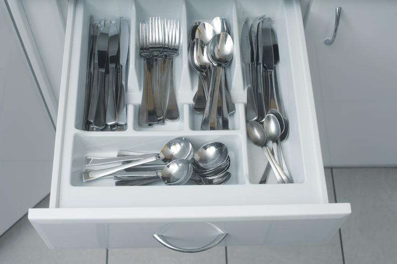 a modern kitchen drawer full of cutlery