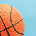 10983   Close up Basketball Ball on a Sky Blue Background