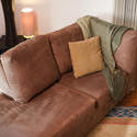 8831   Comfortable couch with a woollen throw