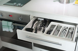10658   Open cutlery drawer in a kitchen cabinet