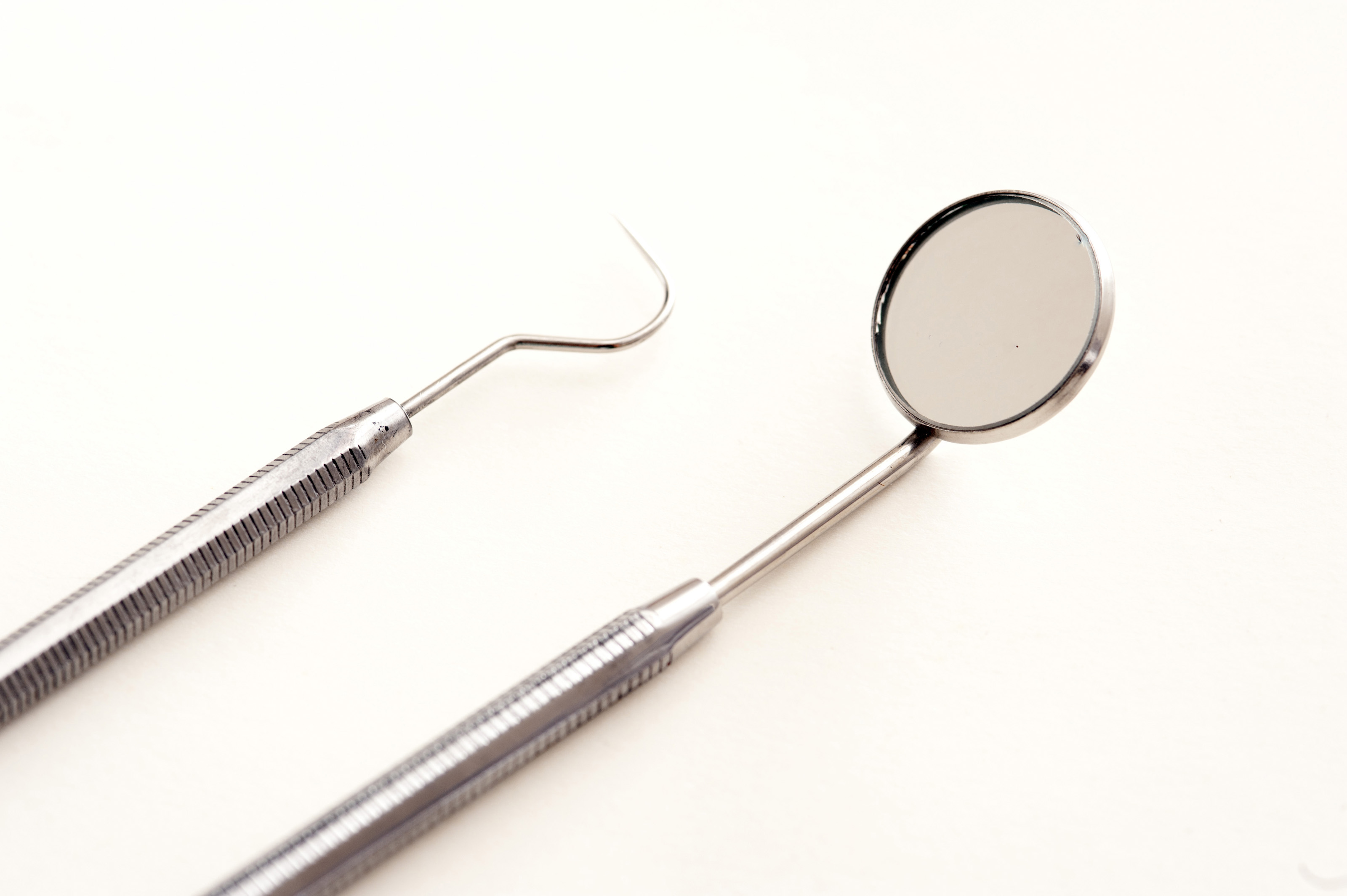 Free Stock Photo 11543 Dental Pick and Mirror on White Background | freeimageslive