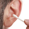 11544   Man cleaning his ear with an ear bud