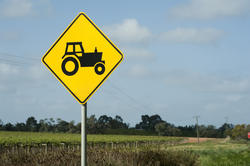 10781   Farm Sign with Tractor Symbol at the Green Field
