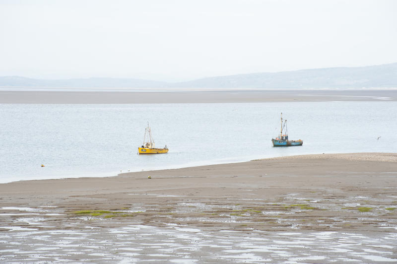 Fishing boats at Morecambe Bay moored offshoe off the notorious Morecambe sands on the Lancashire coast
