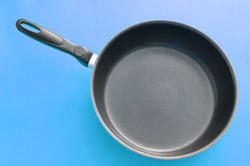 10638   Black Frying Pan on a Sky Blue Gradient Background