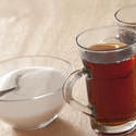 11636   Two glass mugs of hot sweet tea