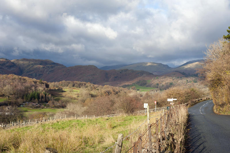 Country road through the Langdales, a scenic valley in the Lake District National Park in Cumbria