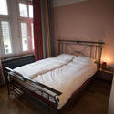 8935   Large bedroom with a wrought iron bed