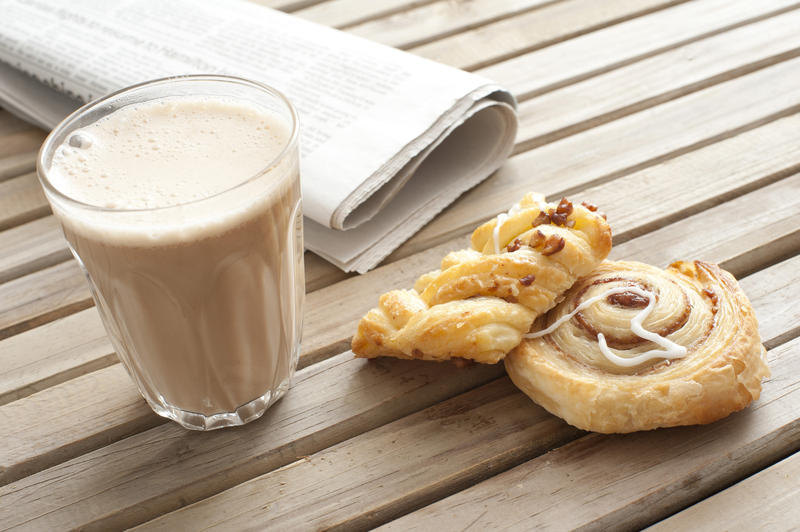 11655   Cup of cacao, pastry and fresh newspaper