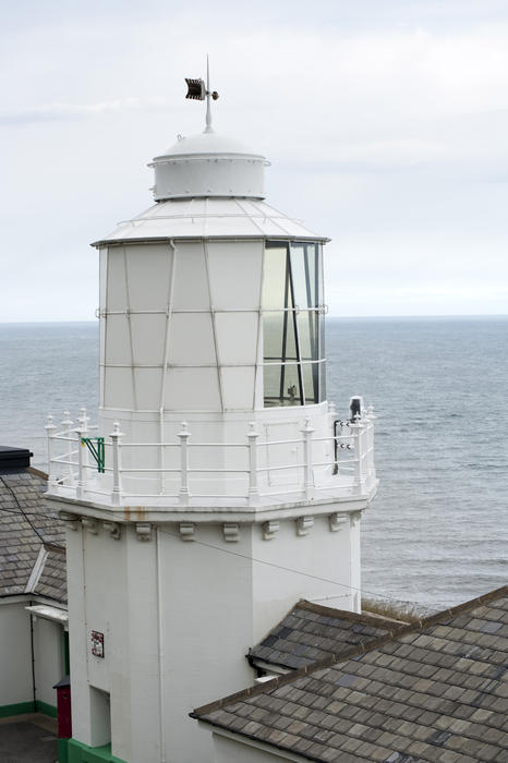 Whitby South Lighthouse overlooking the North Yorkshire coastline built to warn ships of the navigational hazard and also as a guide and navigational aid