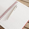10819   Open Blank Notebook with Ballpoint Pen on Top