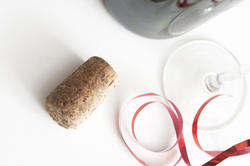 11593   Wine cork lying on white table