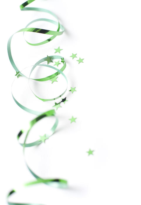 a green ribbon a star shaped glitter background suitable for st patricks day or festive holidays