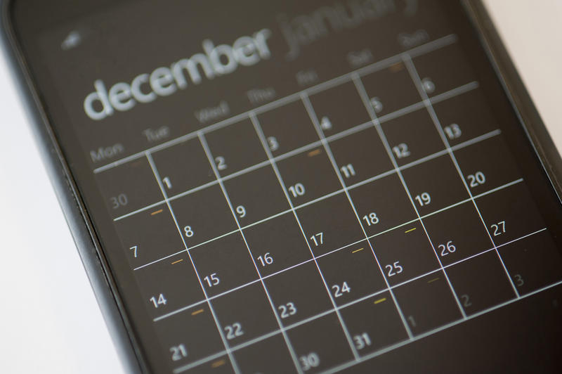 Close up Calendar Application on a Modern Black Touch Screen Mobile Phone with White Background.