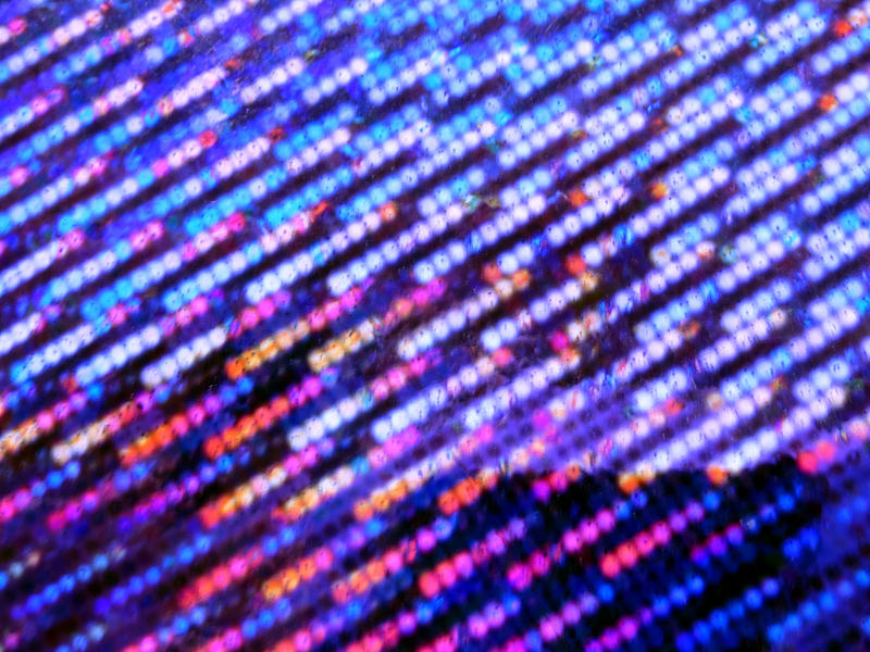 Bokeh of lines of purple lights running diagonally across the frame for a festive abstract background
