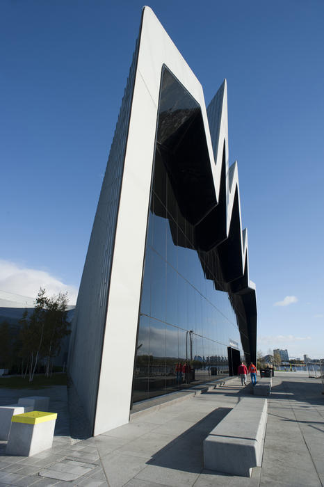 View down the length of the modern architectural design of the front facade of the Riverside Museum , Glasgow