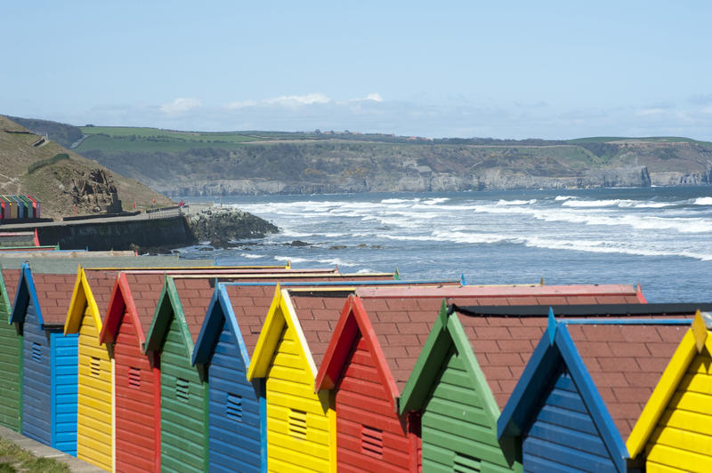 Close up shot of Beach huts at Whitby sands, West Cliff